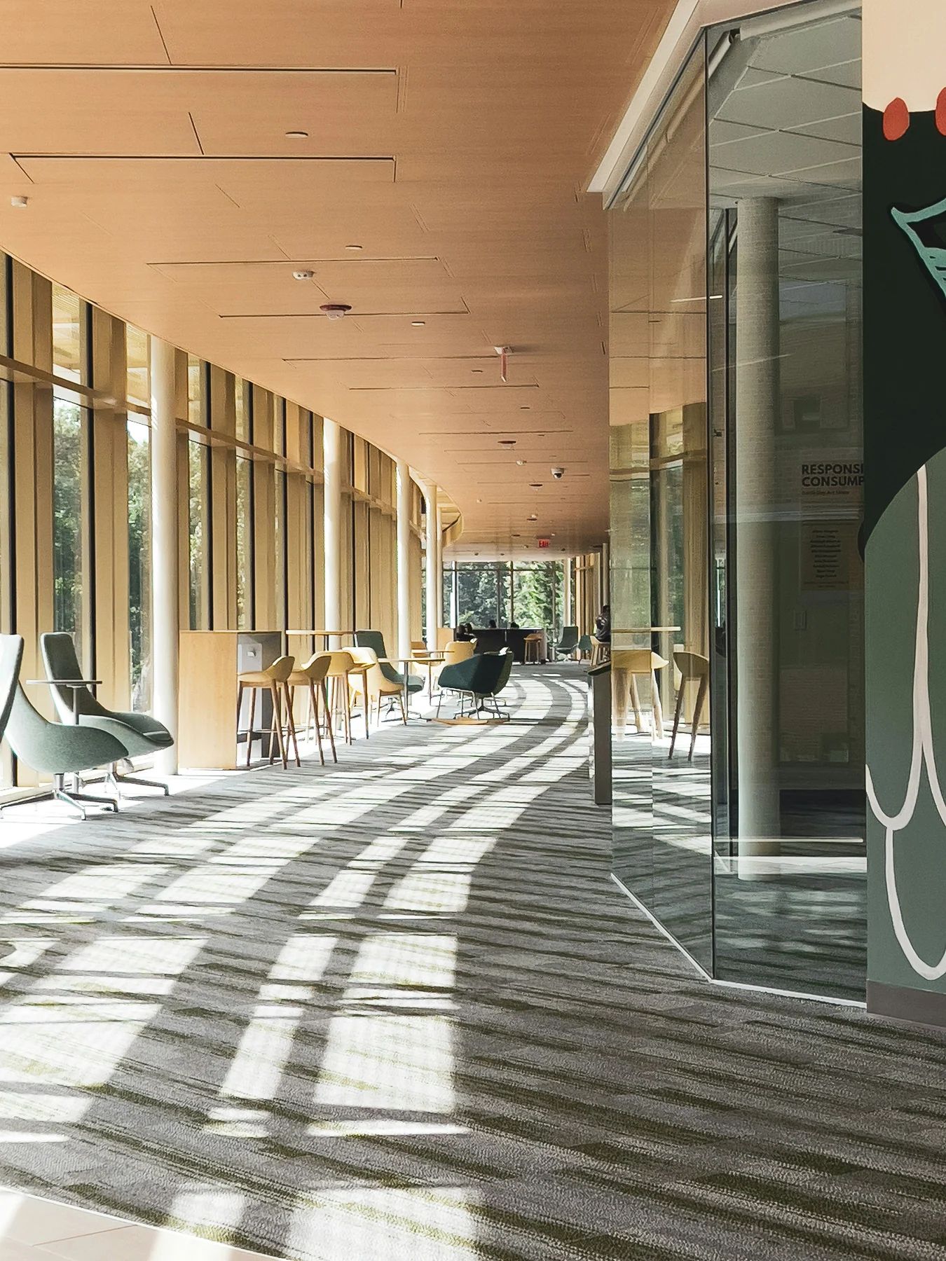 Sunlit commercial building interior with a seating area