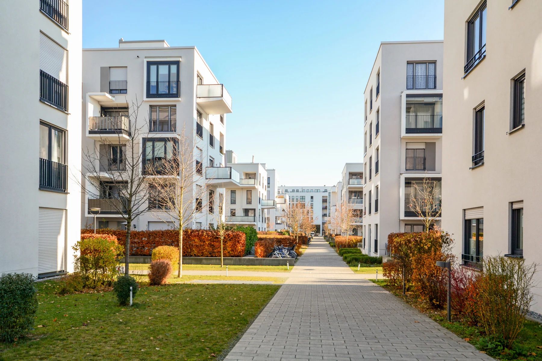 Landscaped courtyard between multifamily residential buildings